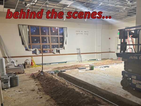 room with chipped up cement floor windows and construction equipment